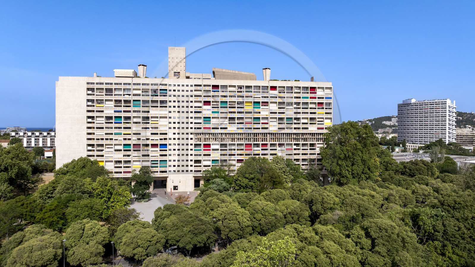 France, Bouches du Rhone, Marseille, architectural work of Le Corbusier, listed as World heritage by UNESCO, the Cité Radieuse by the architect Le Corbusier and the Le Brasilia building designed by the architect Fernand Boukobza under the influence of Le Corbusier in the background (aerial view)