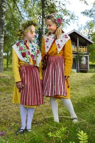 Sweden, Dalarna County, Leksand area, children in traditional costumes for the Midsummer celebrations in the tiny hamlet of Sunnanäng