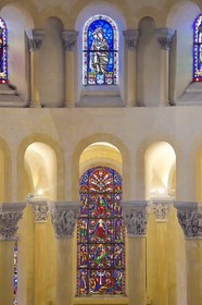 France, Puy de Dome, Clermont Ferrand, Notre-Dame-du-Port basilica in Auvergne Romanesque style, listed as a UNESCO World Heritage Site under the Routes of Saint-Jacques-de-Compostelle in France, 19th century stained glass window in the axis of the choir by Étienne Thévenot which presents the Tree of Jesse and capitals