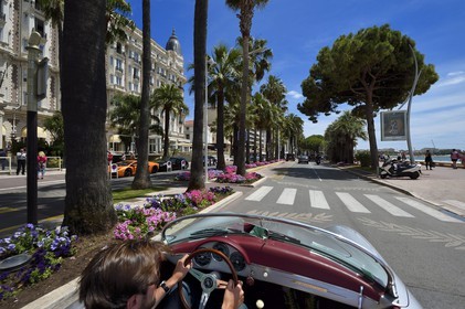 France, Alpes-Maritimes, Cannes, the Carlton palace on the boulevard de la Croisette, aboard a collection convertible Porsche Speedster 356