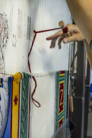 France, Herault, Lodève, Manufacture de la Savonnerie (Savonnerie manufactory) unique annex of the National Carpet Factory of the Savonnerie des Gobelins in Paris, manufacture of the Cohortes carpet after a model by Jacques-Louis de la Hamayde de Saint-Ange intended for the Palace of the Legion of Honor, wool lockstitch by a loop with a tapestry brooch