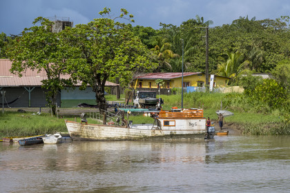 France, French Guiana, Iracoubo, boat transporting goods on the Iracoubo River