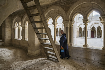 France, Yonne, regional natural park of Morvan, Vézelay, a UNESCO World Heritage site, labelled Les Plus Beaux Villages de France, starting point of one of the main ways to Santiago de Compostela, the Basilica of Saint Mary Magdalene, Brother Matteo of the Jerusalem Fraternity in black tunic and chasuble in the galleries overlooking the choir