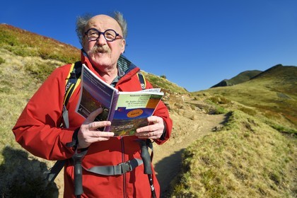 France, Cantal, Parc Naturel Régional des Volcans d'Auvergne (regional nature park of Auvergne volcanoes), Le Lioran to the Col de Rombière,  Bernard Quinsat who imagined the Via Arverna in the 2000s on the way to Saint Jacques de Compostela and founder of the guide publishing house Chamina