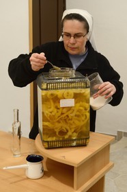Croatia, Dalmatia, Dalmatian Coast, Ugljan Island, Franciscan St. Jerome Convent of the Congregation of the Sisters of Mercy, sister Theresija prepares a fruit liquor