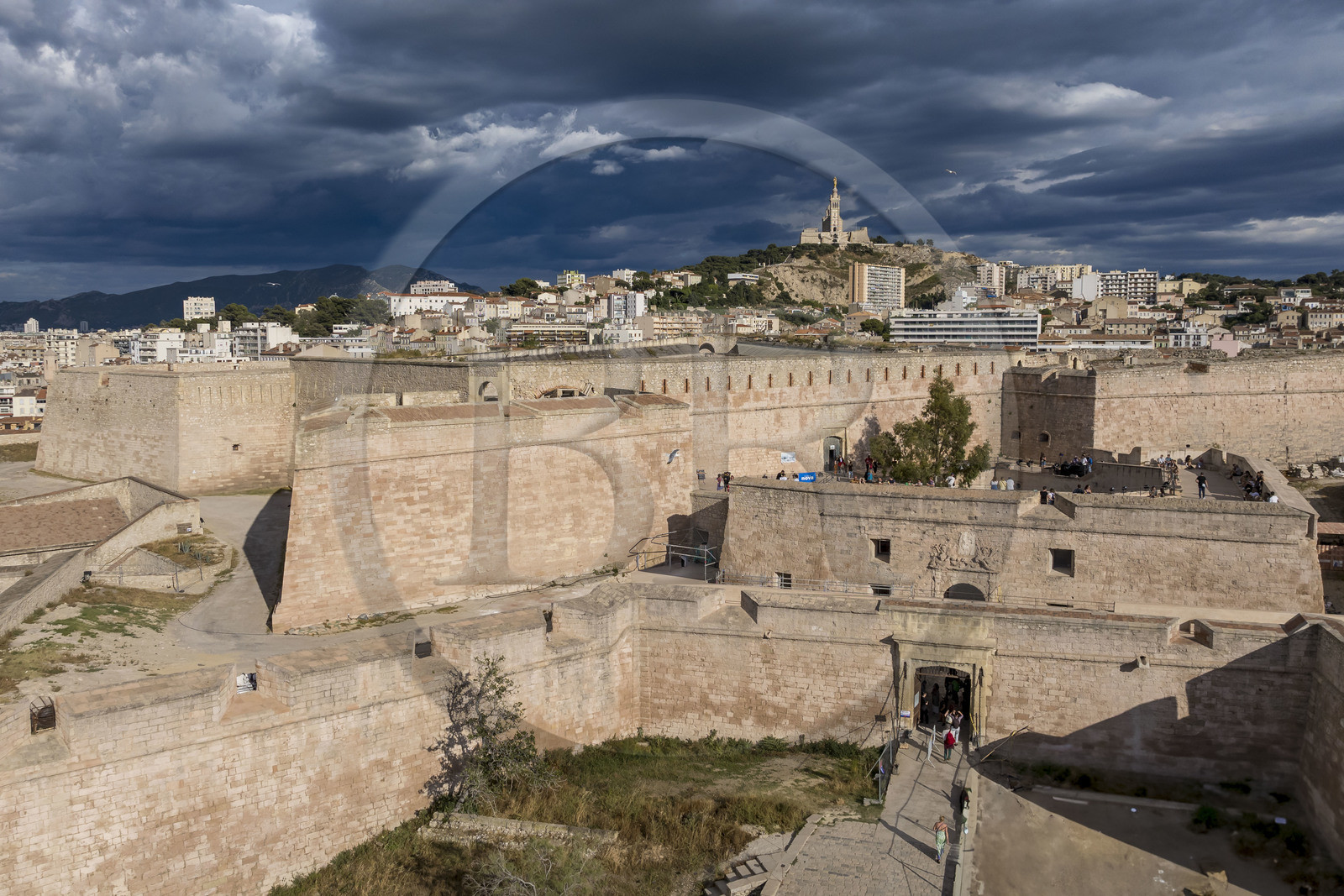 France, Bouches du Rhone, Marseille, Citadelle de Marseille (Fort Saint Nicolas, the upper fort called Fort d’Entrecasteaux) and Notre Dame de la Garde basilica in the background (aerial view)