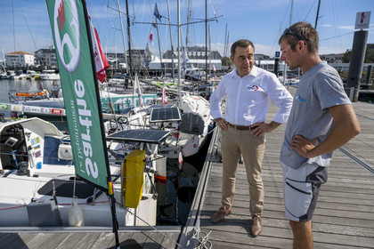 France, Vendee, Les Sables d'Olonne, Port Olona, Vendée Globe sailboat pontoon, Mini 6.50 class monohull regatta sailing boat preparing to participate at the minitransat, the president of the Vendée Globe Alain Leboeuf in discussion with the young skipper Hugo Cardon