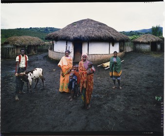 Burundi, Bujumbura Province, Ijenda area, Tutsi family in the main courtyard of the rugo (traditional farm) (4x5 reversal film reproduction)