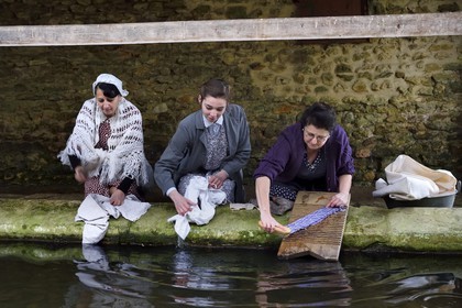 France, Eure, old wash-house of Sainte Colombe prés Vernon, Allied Reconstitution Group (US World War 2 and french Maquis historical reconstruction Association), the reenactors showing three women washing clothes in the washhouse in the 1940s