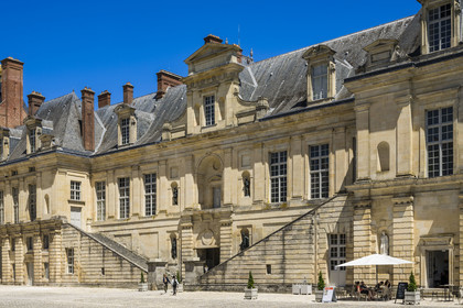 France, Seine-et-Marne, Fontainebleau, castle of Fontainebleau listed as World Heritage by UNESCO, the Belle Cheminée wing and its monumental staircase overlooking the Cour de la Fontaine