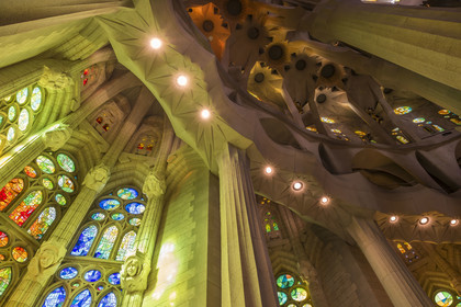 Spain, Catalonia, Barcelona, Eixample district, Sagrada Familia basilica by Catalan modernist architect Antoni Gaudi, listed as a UNESCO World Heritage Site, stained glass windows of the apse above the ambulatory by the Catalan painter and glassmaker Joan Vila-Grau