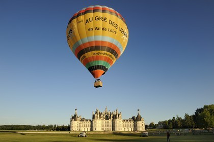 France, Loir et Cher, Loire Valley listed as World Heritage by UNESCO, Chateau de Chambord, air balloon taking off