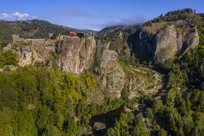 France, Haute Loire, Loire river Valley, Arlempdes, labelized the Most Beautiful Villages of France, ruins of the castle perched on a basalt rock (volcanic dyke) overlooking a Loire river meander (aerial view)