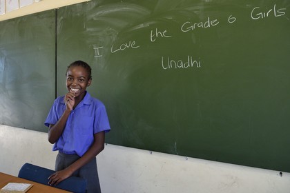Namibia, Erongo region, Damaraland, the Spitzkoppe in the Namib Desert, Katora Primary School, young girl in the classroom grade 6