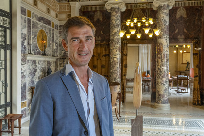 France, Alpes-Maritimes, Beaulieu-sur-Mer, neo-Greek style villa Kerylos build in 1908 by architect Emmanuel Pontremoli, the curator Antide Viand in the Andron or men's lounge