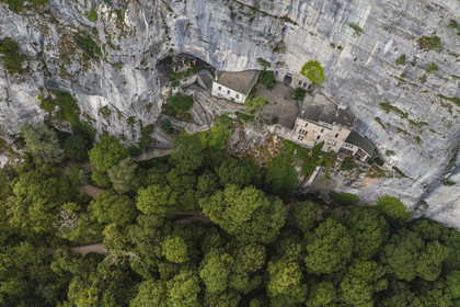 France, Var, Plan d'Aups Sainte Baume, Sainte-Baume Regional Nature Park, Sainte Baume massif, the cave sanctuary of Sainte Marie-Madeleine (St. Mary Magdalene) on the side of the 300m cliff (aerial view)