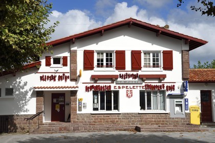 France, Pyrenees Atlantiques, Basque Country, Espelette, drying of Espelette peppers on the facades of village houses, the Post office
