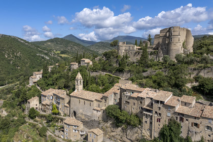 France, Drome, regional natural park of Baronnies provencales, Montbrun les Bains, labeled the Most Beautiful Villages of France, the village and the Renaissance castle of Dupuy-Montbrun (aerial view)