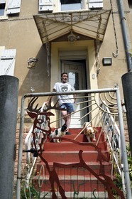 France, Moselle, Petite Rosselle, former workers housing district of the industrial city created by the Wendel family for coal mines, the former miner Raphael Alcudia Gomez in front of his miner's house dating from 1908