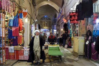 Iran, Isfahan Province, Isfahan, mullah in the Bazar-e Bozorg (Great Bazaar), a massive covered bazaar which dates back almost 1300 years