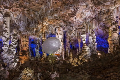 France, Gard, Mejannes-le-Clap, grotte de La Salamandre (Salamander cave), discovery of the cave in Aéroplume®, an individual dirigible balloon inflated with helium which allows you to fly away by flapping your wings