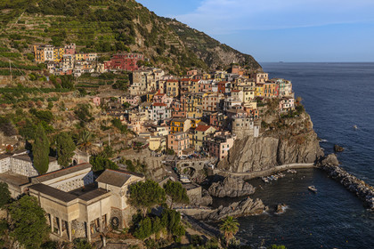 Italy, Liguria, Cinque Terre National Park listed as World Heritage by UNESCO, village of Manarola and its harbour (aerial view)