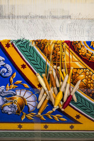 France, Herault, Lodève, Manufacture de la Savonnerie (Savonnerie manufactory) unique annex of the National Carpet Factory of the Savonnerie des Gobelins in Paris, manufacture of the Cohortes carpet on the weaving loom after a model by Jacques-Louis de la Hamayde de Saint-Ange intended for the Palace of the Legion of Honor, tapestry brooches