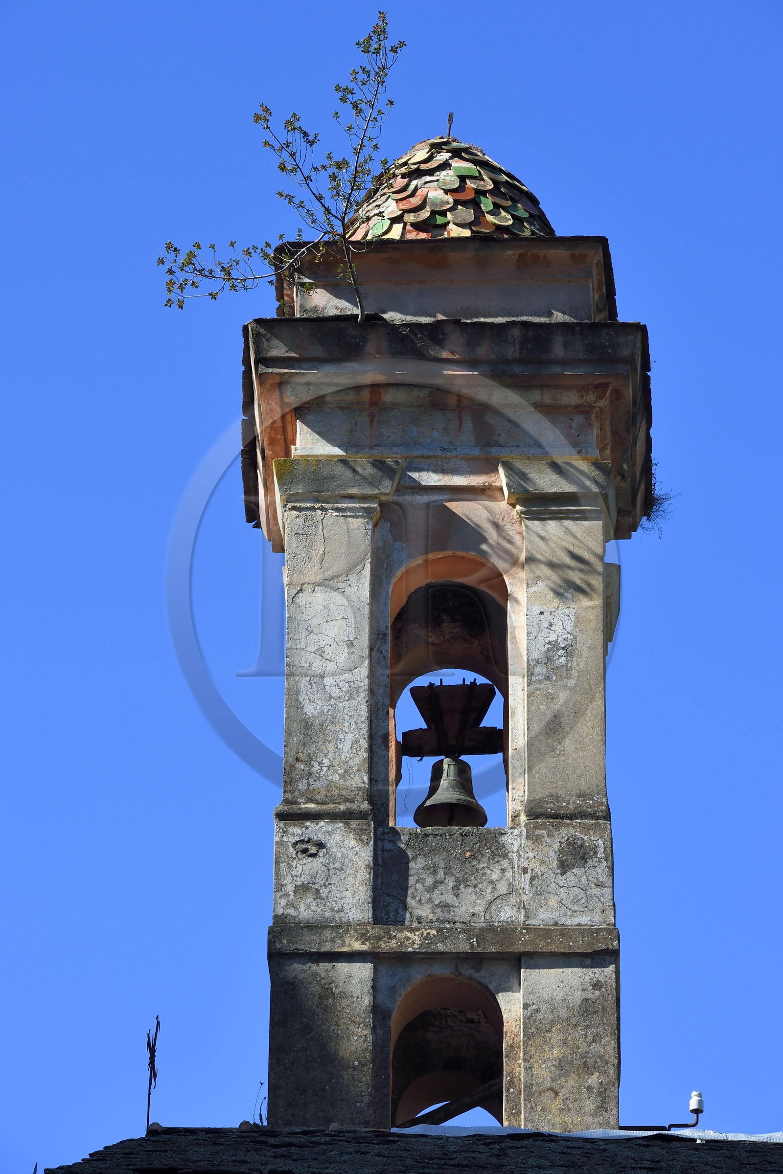 France, Alpes-Maritimes, Roya Valley (Nice hinterland), at the foot of the Mercantour National Park, Saorge, glazed tiles bell tower of the red Penitents St. Sebastian chapel