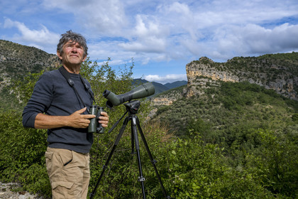 France, Drome, regional natural park of Baronnies provencales, Saint-May, Christian Tessier, director of the Vautours en Baronnies association, observing griffon vultures