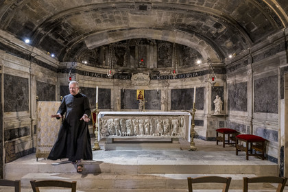 France, Bouches du Rhone, Tarascon, the royal collegiate church of Sainte-Marthe built in the 11th and 12th centuries, the 4th century crypt remodeled in the 17th century, houses  the paleochristian sarcophagus in white marble (from the beginning of the 4th century) which contains the relics of Saint Martha, Father Michel Savalli in charge of the church