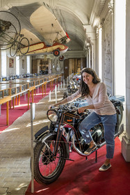 France, Cote d'Or, Côte de Beaune, Savigny-les-Beaune, the castle with museums and collections of fighter planes, Abarth racing cars, motorcycles, straddle tractors, models, fire trucks, Marie Pont poses with the Durandal motorcycle (1937), the first motorcycle collected by her great-grandfather