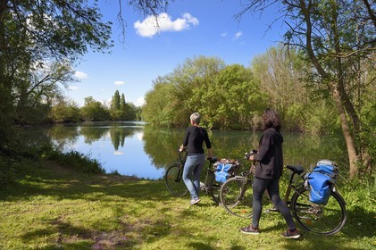 France, Charente, the Charente river between Sireuil and Saint-Simeux, cyclists on the Flow Vélo cycle route