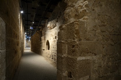 Israel, North district, Galilee, Acre (Akko), old town, listed as World Heritage by UNESCO, the Crusaders underground city just beside the Hospitaller fortress, the southern street and a shop wall