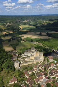 France, Dordogne, Perigord Noir, Dordogne Valley, Castelnaud la Chapelle, labelled Les Plus Beaux Villages de France (The Most Beautiful Villages of France), Castelnaud Castle on a cliff above the Dordogne valley (aerial view)