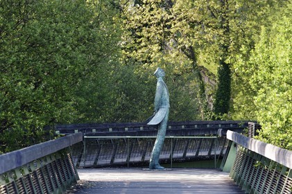 France, Charente, Angouleme, Corto Maltese, bronze sculpture by Luc and Livio Benedetti, on the Hugo Pratt footbridge over the Charente river which connects the buildings of the Cité internationale de la bande dessinée et de l’image (CIBDI)(International city of comics and images)