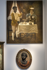 France, Paris, Marais district, Carnavalet Museum, Paris sign room, Au Nègre Joyeux, a grocery store selling exotic products formerly on rue Mouffetard (1897) above  The Black Head, wine merchant's sign formerly on rue du Faubourg Saint-Antoine (18th century)