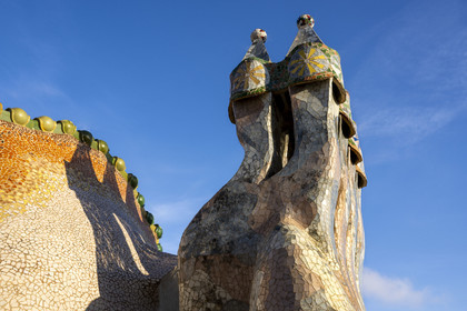 Spain, Catalonia, Barcelona, Eixample district, Passeig de Gracia, Casa Batllo by Catalan modernist architect Antoni Gaudi, UNESCO World Heritage site, chimneys and roof suggesting the dragon's spine