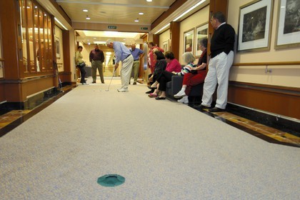 Italy, cruise aboard the Silvershadow ship of the company Silversea, mini golf game in the passageways of the ship