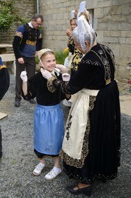 France, Finistere, Locronan, labelled Les plus Beaux Villages de France (The Most Beautiful Villages of France), adjustment of the traditional costumes the morning of the procession of the small Troménie in front of the Louboutin family farm