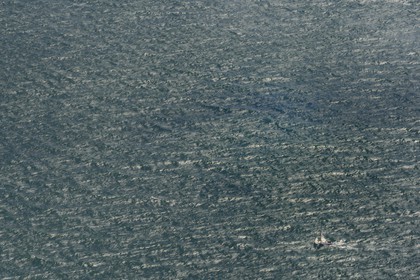 United Kingdom, England, sailboat sailing in the English Channel (aerial view)