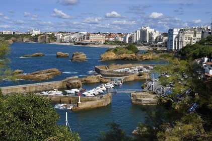 France, Pyrenees Atlantiques, Basque Country, Biarritz, Port des Pecheurs, Sainte Eugenie church and facades of the buildings located on Grande Plage (Great beach)
