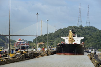 Panama, Panama Canal, Pedro Miguel locks, mechanical mules or electric locomotives guiding a Panamax cargo between the lock walls