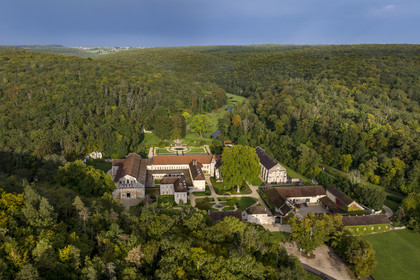 France, Cote d'Or, Marmagne, the Cistercian Abbey of Fontenay founded in 1118, listed as World Heritage by UNESCO, the valley of the ru (stream) of Fontenay in the background (aerial view)