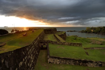 Sri Lanka, Southern Province, Galle Fort, listed as World heritage by UNESCO, sunset over the fortifications Grass-clad walls overlooking the sea