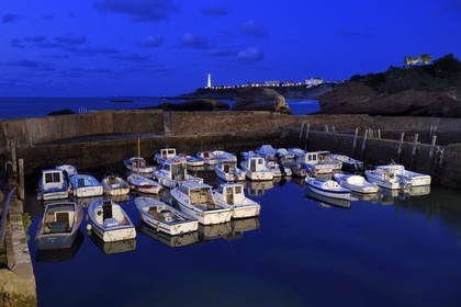France, Pyrenees Atlantiques, Basque Country, Biarritz, Port des Pecheurs, the lighthouse and the rocher du Basta in the background