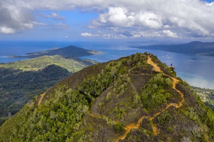 France, Mayotte island (French overseas department), Grande-Terre, Southern Crete Forest Reserve (Reserve Forestiere des Cretes du Sud), hikers at the summit of Mount Choungui (594 meters) and the Bay of Bouéni in the background (aerial view)