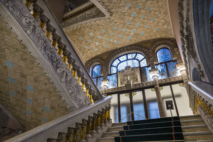 Spain, Catalonia, Barcelona, Palau de la Musica Catalana (Catalan Music Palace), concert hall designed by the architect of Catalan modernism Lluis Domènech i Montaner, a UNESCO World Heritage Site, vestibule, the banister of the stairs in finely worked stone and supported by balusters in transparent yellow glass