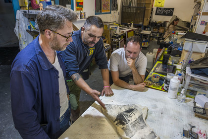 France, Vaucluse, Avignon, Turboformat workshop, artist Ben Sanair on the right in his workshop with artist Lionel Vivier checking his stone plates under the gaze of Stéphane Ibars, artistic director of the Lambert Collection