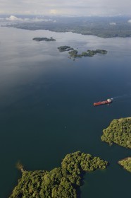 Panama, Panama Canal, Panamax cargo and small islands on Gatun Lake (aerial view)