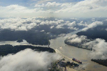 Panama, Panama Canal at Gamboa, the arm of the Chagres River which supplies the water to the canal and Gatun Lake, the Gaillard cut (or cut Culebra) and the skyline of Panama City in the background (aerial view)